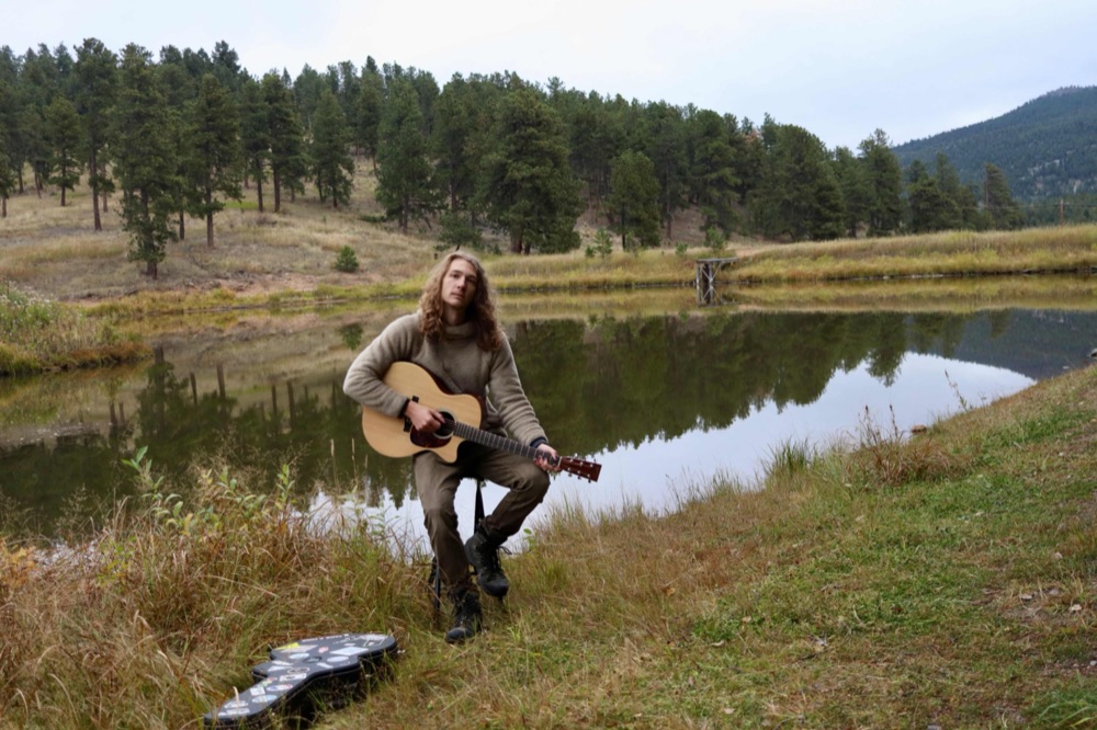 Syler Dane by a mountain lake